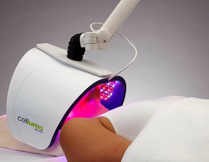 Celluma LED light therapy panel positioned over a treatment bed