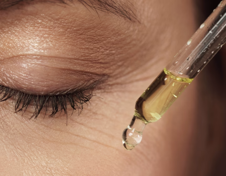 Serum being applied beneath the eye during a treatment