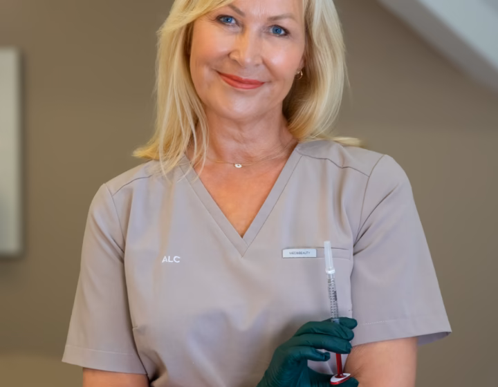 Sally O’Donnell, registered nurse, holding a pre-filled syringe in the clinic