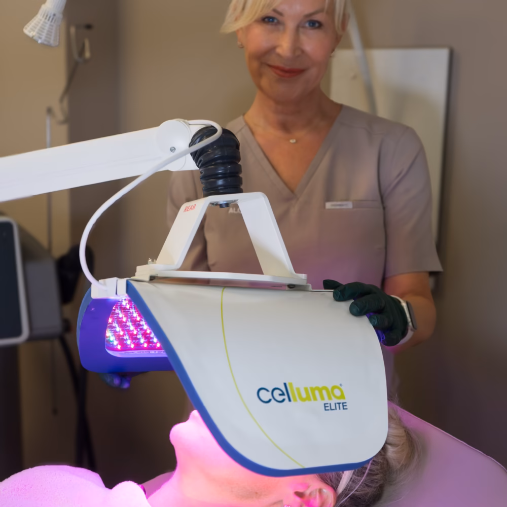 Sally O’Donnell positioning the Celluma LED panel over a client