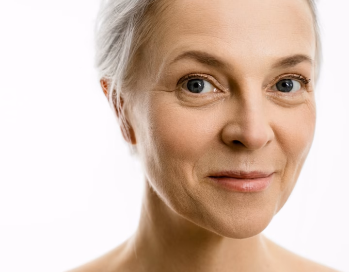 Close-up portrait of a woman in her sixties with healthy, natural skin